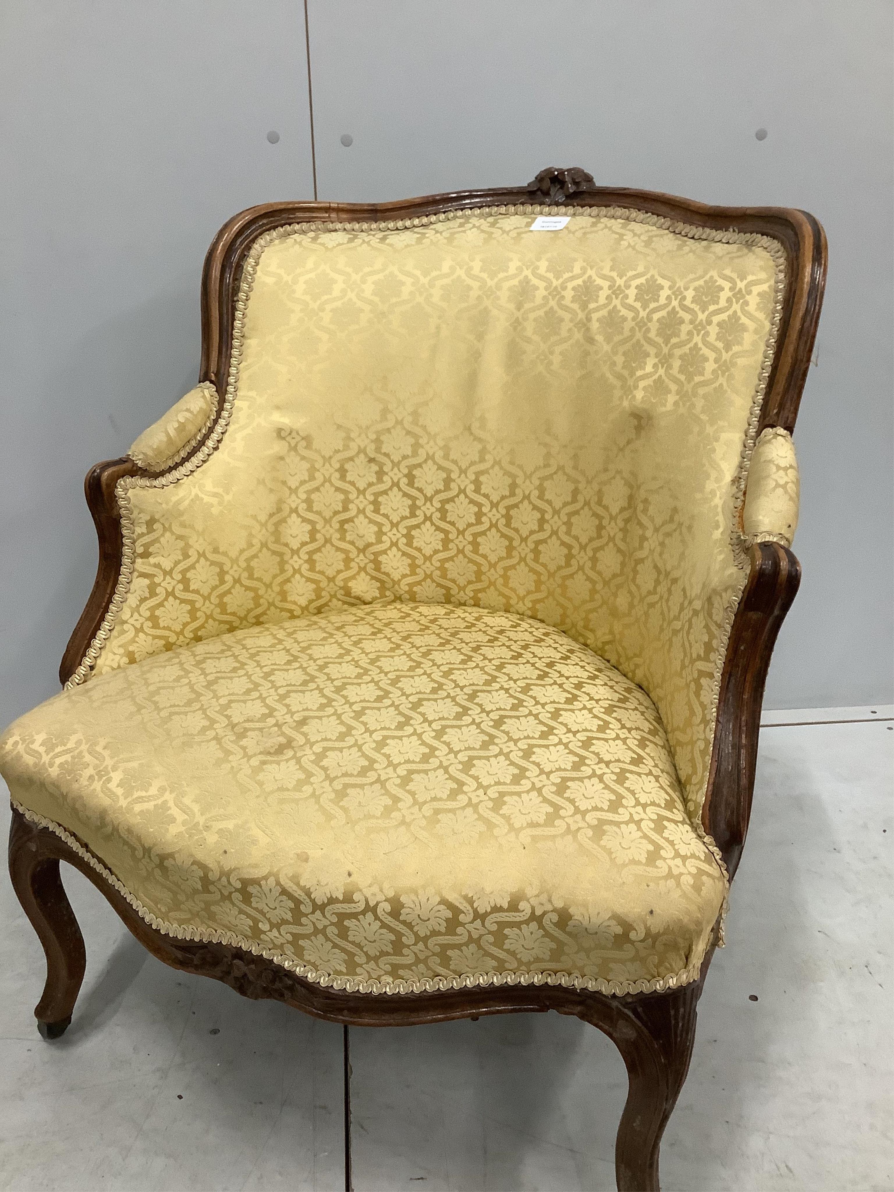 A 19th century Louis XVI style carved walnut armchair, width 71cm, depth 78cm, height 85cm. Condition - fair